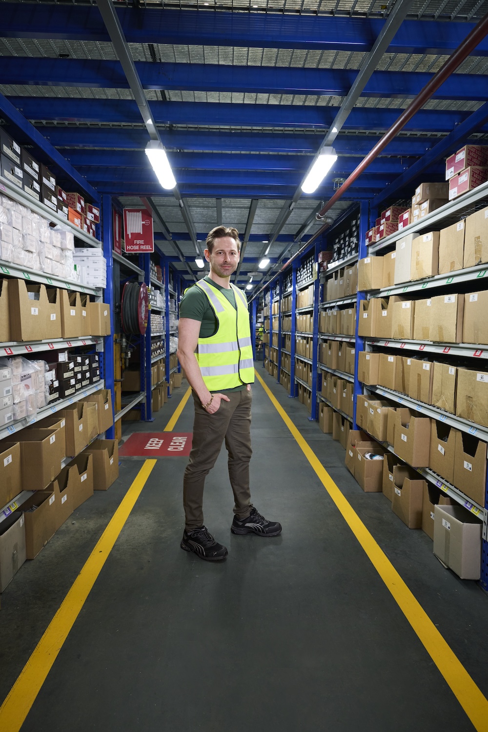 Karl Friesenbichler 
in warehouse aisle